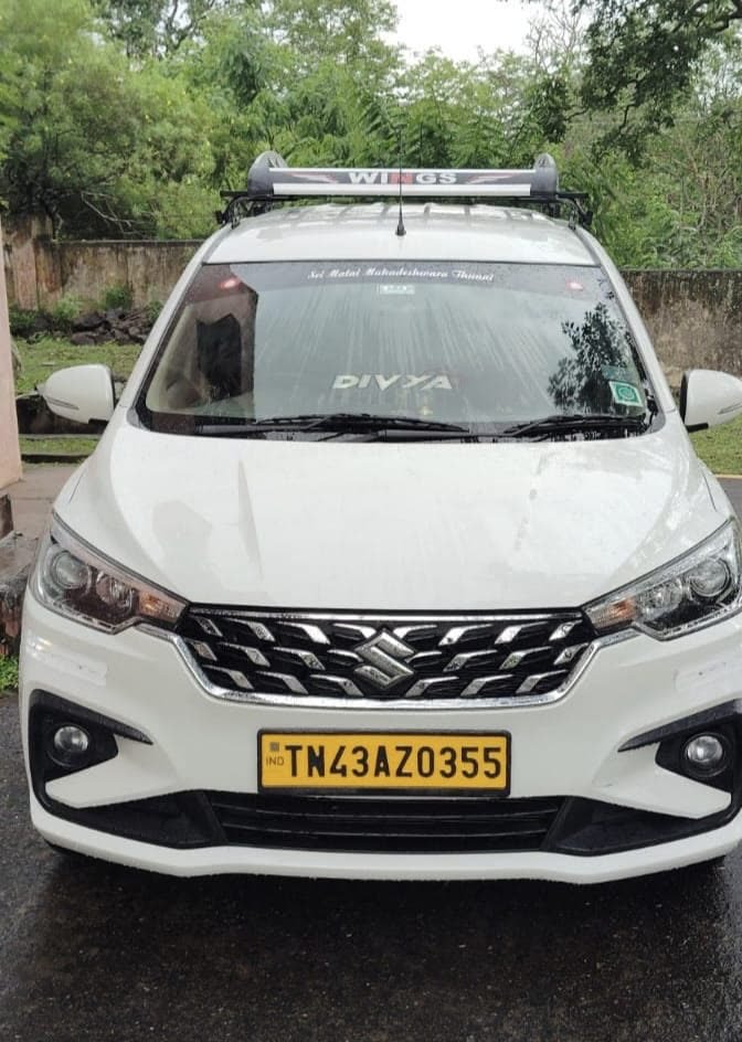 Divya, the white family sedan